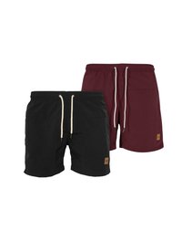 Černé a burgundské plavecké šortky s elastickým pasem, šňůrkami a béžovými logy; obě mají jednobarevný design a volný střih.