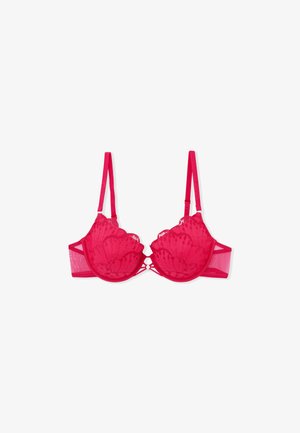 Red lace bra with scalloped edge cups, sheer mesh sides, and adjustable straps. Features floral patterns and a decorative front clasp.
