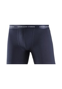 Tmavomodré boxer nohavičky vyrobené z mäkkej tkaniny, s priliehavým strihom, stredne vysokým pásom s logom "COPENHAGEN STUDIOS" a hladkou textúrou.