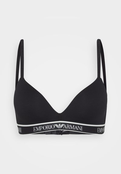 Black triangle bra made of soft fabric, with thin adjustable straps. Features a wide branded elastic band in white and black at the bottom.