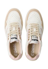 White sneakers with pink accents, leather and textile material, round toe, lace-up design, perforated details, and visible brand logo inside.