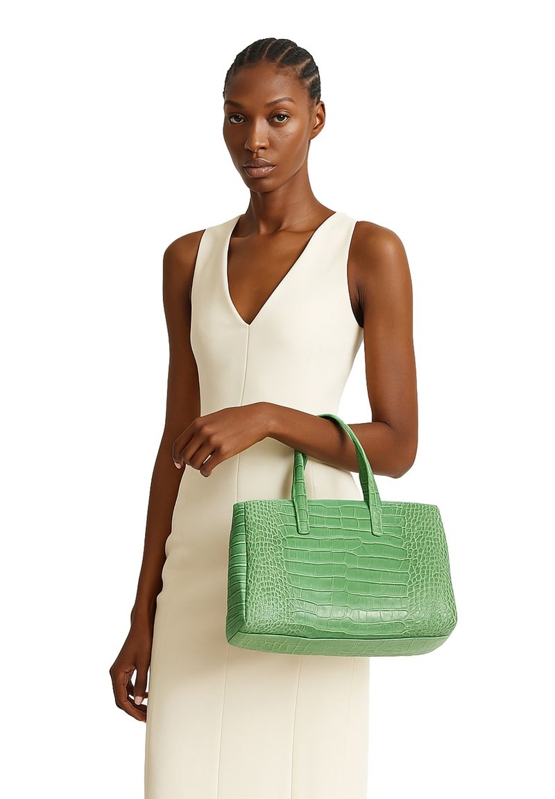 Borsa a mano in pelle verde con decorazione a forma di coccodrillo, dalla forma strutturata, con doppio manico e superficie liscia. Design leggero e compatto.