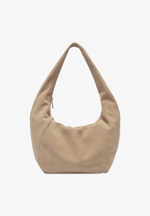 Sac en tissu beige à forme arrondie, avec une seule longue anse et une fermeture éclair. Texture douce et design minimaliste.