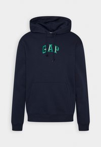 Sweat à capuche bleu marine avec poche avant et logo vert "GAP" brodé sur la poitrine, doté d'une capuche avec cordon et de poignets côtelés.