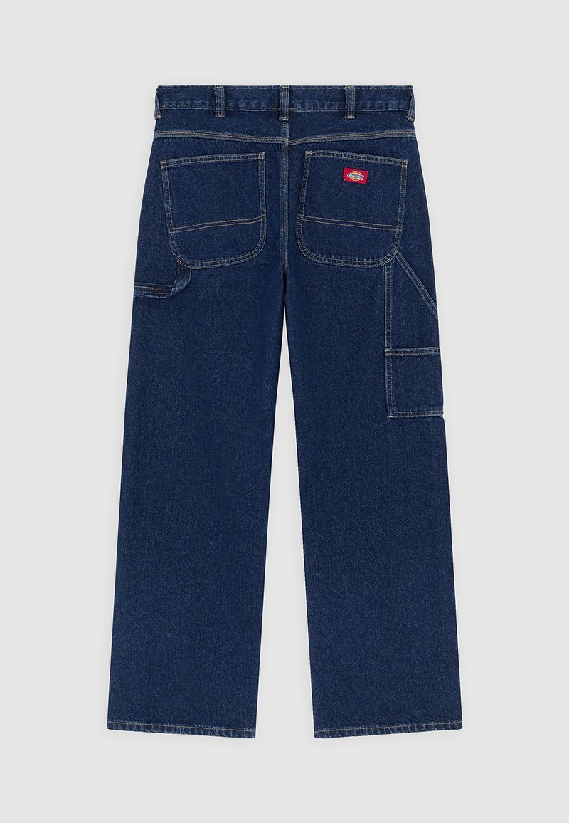 Mørkeblå denimarbejdsbukser med vide ben, to store baglommer, sidelomme til værktøj og et rødt mærke på højre baglomme.