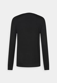 Maglione nero a maniche lunghe con scollatura rotonda, realizzato in un tessuto liscio. Presenta un design aderente e polsini e orlo a coste.