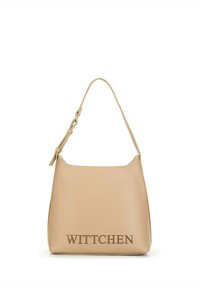 Beżowa skórzana torebka o zaokrąglonym kształcie, regulowanym pasku i wytłoczonym logo "WITTCHEN" na dole. Gładka faktura, minimalistyczny design.