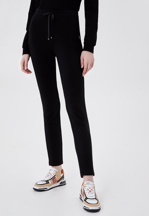 Pantalones deportivos - black