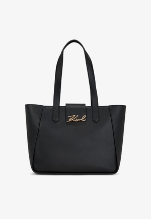 Fekete bőr bevásárlótáska arany színű fémrészletekkel, a márkanevével az elülső fedélen. Sima textúra és dupla vállpánt.