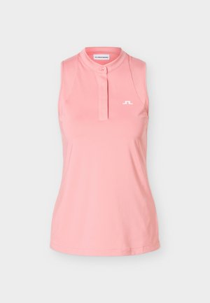 Brezrokavnik lahkotne roza barve z majhnim belim logotipom na levi strani prsnega koša in zgornjim gumbom na ovratniku.