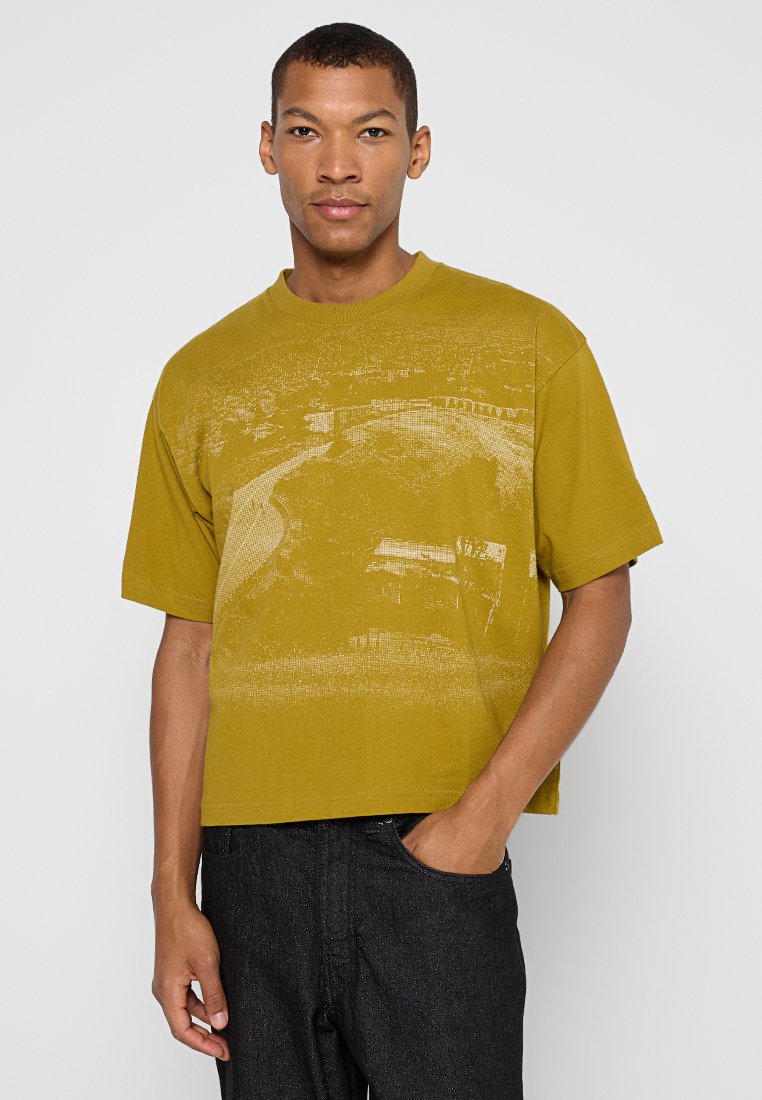 Vans T-shirt print goudkleurig