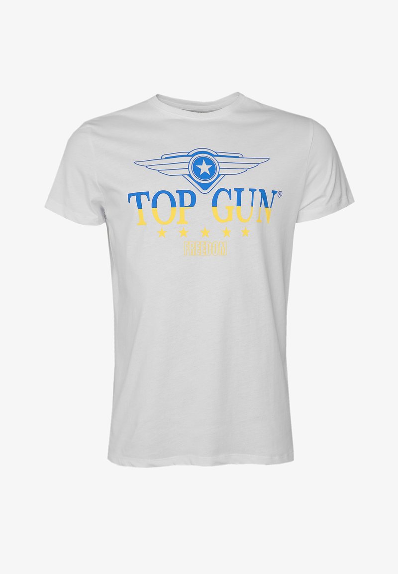 Hvid bomulds t-shirt med et blåt og gult grafisk design med teksten "TOP GUN" og "FREEDOM", omgivet af fem gule stjerner. Korte ærmer.