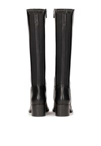 Knee-high black leather boots with a smooth finish, elastic side panels, and a low stacked heel. Includes a rear zipper for easy wear.