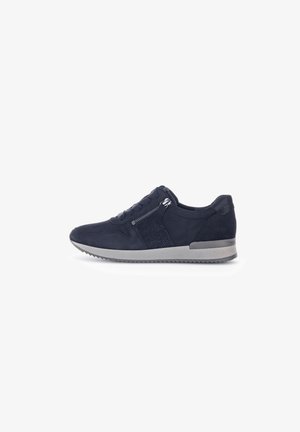 Navy suede sneaker with textured side panel, top lacing, and zip detail. Features a contrasting gray rubber sole and rounded toe.