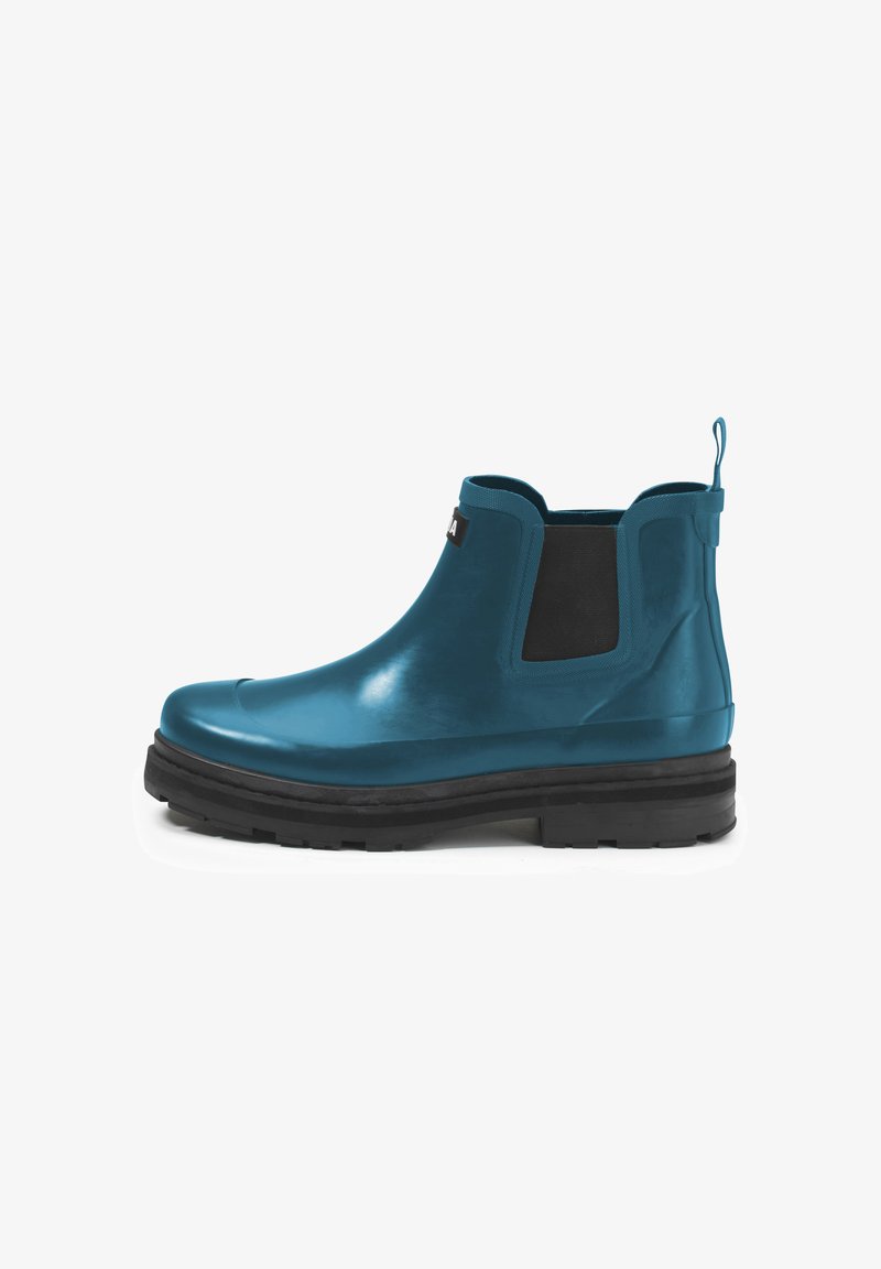 Botas de tobillo de goma en color azul verdoso con una superficie suave, paneles laterales elásticos y una suela de goma negra; cuentan con una tira en el talón para facilitar el uso.