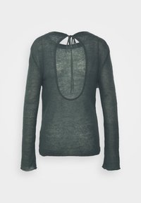 Dark green lightweight knit sweater with long sleeves and deep open back tied at the neckline with two strings.