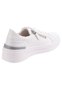 White leather sneaker with a chunky white sole, gray accent, and side zipper detail. Laces along the front for secure fitting.