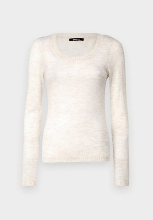 Heledbeez värvi pika varrukaga sviiter, millel on ümmargune kaelaaugu lõige. Pehme, tekstuuriga kangas ja soonikkoes mansetid, millel on vähenenud gradientmuster.