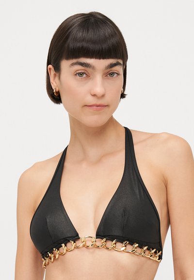 Black triangle bikini top with a chain link accent. Features a smooth texture and halter neck design. Gold hardware stands out against the fabric.