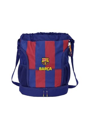 Sac de sport Barça rayé bleu et rouge avec une bandoulière, des poches latérales en maille et un compartiment inférieur zippé.