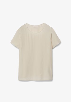 Camicia a maniche corte di colore beige chiaro con scollatura rotonda e texture liscia. Presenta un design pulito e semplice senza motivi o dettagli aggiuntivi.