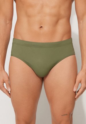 Olivgrüne Schwimmhosen aus glattem, elastischem Material mit konturiertem Schnitt, einfachem Design und robusten Nähten.