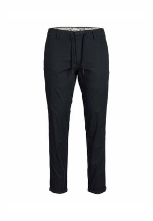 Pantaloni neri in cotone, con vita regolabile tramite cordoncino, vestibilità slim e orli arrotolati. L'interno presenta una fodera a fantasia.