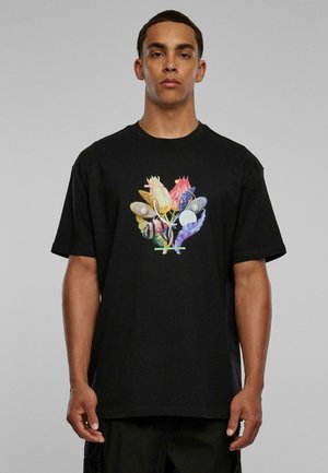 Black cotton t-shirt featuring a colorful graphic design of various botanical elements on the front. Short sleeves and crew neckline.