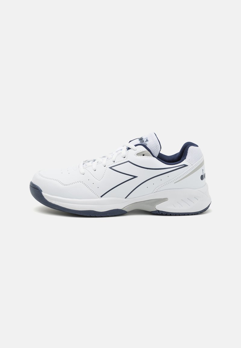 White athletic shoe with navy accents, mesh panels, and a textured sole. Features a lace-up design and a prominent side logo detail.