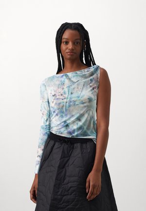 Long-sleeve top in a blue and pastel floral print on lightweight, smooth fabric. Features an asymmetrical neckline and fitted silhouette. Pairing with a black quilted skirt.