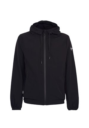 Veste légère noire à capuche avec fermeture éclair frontale, cordons réglables, poignets élastiques et petit logo croix blanche sur la manche gauche.