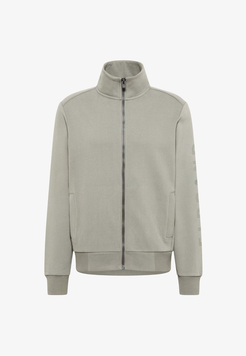 Light gray zip-up jacket with a high collar and long sleeves, featuring side pockets and a vertical printed text detail on the sleeve.