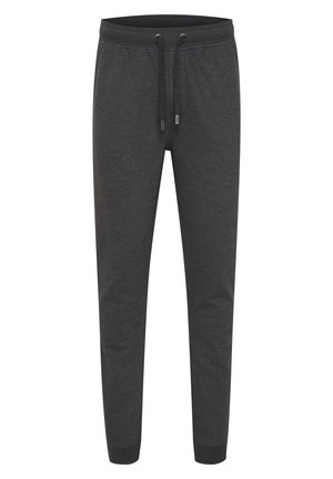 Mørkegrå sweatpants lavet af blødt stof. Har en elastisk talje med snor, tapered ben og ribbede manchetter ved anklerne.