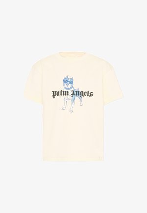 Crèmekleurig T-shirt met een blauwe hond die een zonnebril draagt en de tekst "Palm Angels" in zwarte gotische letters over de borst.