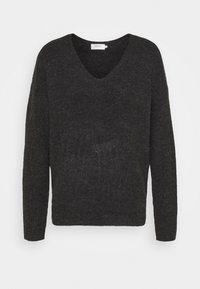Maglione nero lavorato a maglia con scollo a V, maniche lunghe e vestibilità ampia. Realizzato in tessuto strutturato per un comfort maggiore.