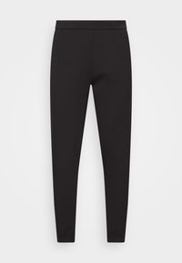 Černé joggingové kalhoty vyrobené z hladké, elastické tkaniny. Mají plochý pas, zúžené manžety a žádné viditelné kapsy nebo vzory.