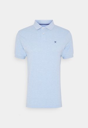 Light blue polo shirt made of cotton, featuring a classic collar, two-button placket, and a navy embroidered logo on the chest.