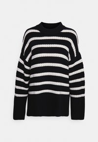 Black and white striped knit sweater with a crew neckline, wide sleeves, and a textured pattern, featuring horizontal stripes of varying widths.