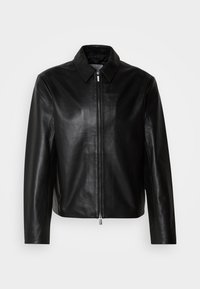 Black leather jacket with a smooth texture, featuring a front zipper and a classic collar. Designed for a tailored silhouette, no visible embellishments.