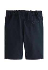 Tumesinised lühikesed püksid, valmistatud kergest kangast, millel on elastne vöökoht, ühe tagataskuga, mis on kinnitatav nööbiga, ja sirge lõige.