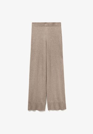 Béžové pletené kalhoty s širokými nohavicemi, ribbovaným pasem a manžetami, s vlnitým lemem.