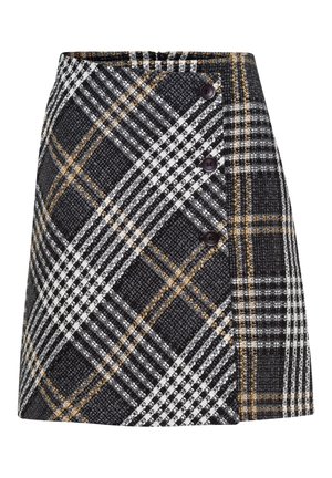 Jupe évasée à carreaux noir et blanc avec accents jaunes, ornée de trois boutons noirs alignés en diagonale sur le côté droit avant.