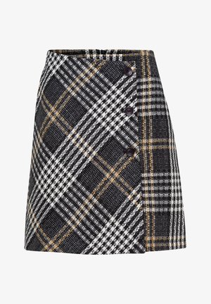 Sort-hvid ternet A-formet nederdel med gule accenter, der har tre sorte knapper diagonalt langs frontens højre side.