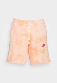 Shorts tie-dye en color melocotón con cintura elástica, cordón ajustable y logo de Nike bordado con una margarita. Tela suave con un corte holgado.
