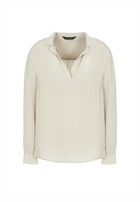 Blusa a maniche lunghe di un leggero beige, realizzata in tessuto morbido. Presenta un colletto e una leggera piega sul davanti, con un orlo arrotondato.