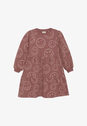 Langärmliges Baumwollkleid in staubrosa, mit einem gestuften Design und einem lächelnden Gesichtsmuster in verschiedenen Größen über den Stoff verteilt.