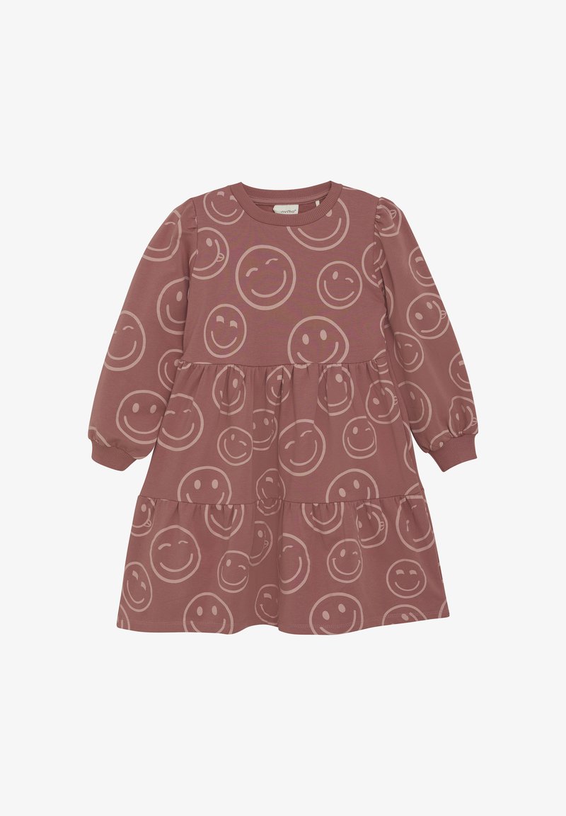 Robe en coton à manches longues couleur rose poussiéreux, avec un design à plusieurs niveaux et un motif de visage souriant de différentes tailles sur le tissu.