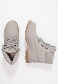 Gray leather ankle boots with rubber soles, round toe, flat laces, and side stitching details; cushioned collar and logo on insole.