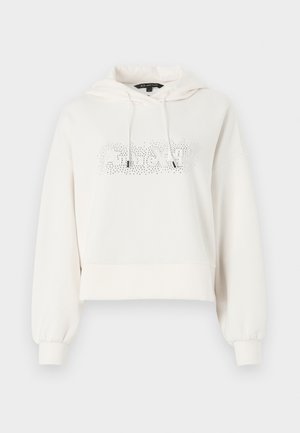 Felpa corta bianca con cappuccio, cordini e una grafica testuale luccicante sul davanti. Tessuto morbido e polsini a costine.