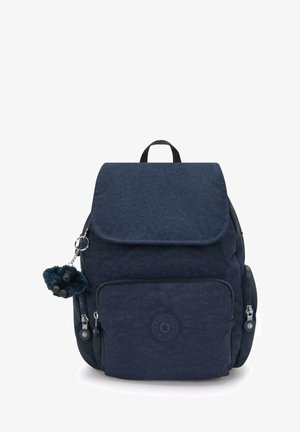 Navy backpack with a textured finish, flap closure, front zipper pocket, round logo, and a detachable fur keychain.